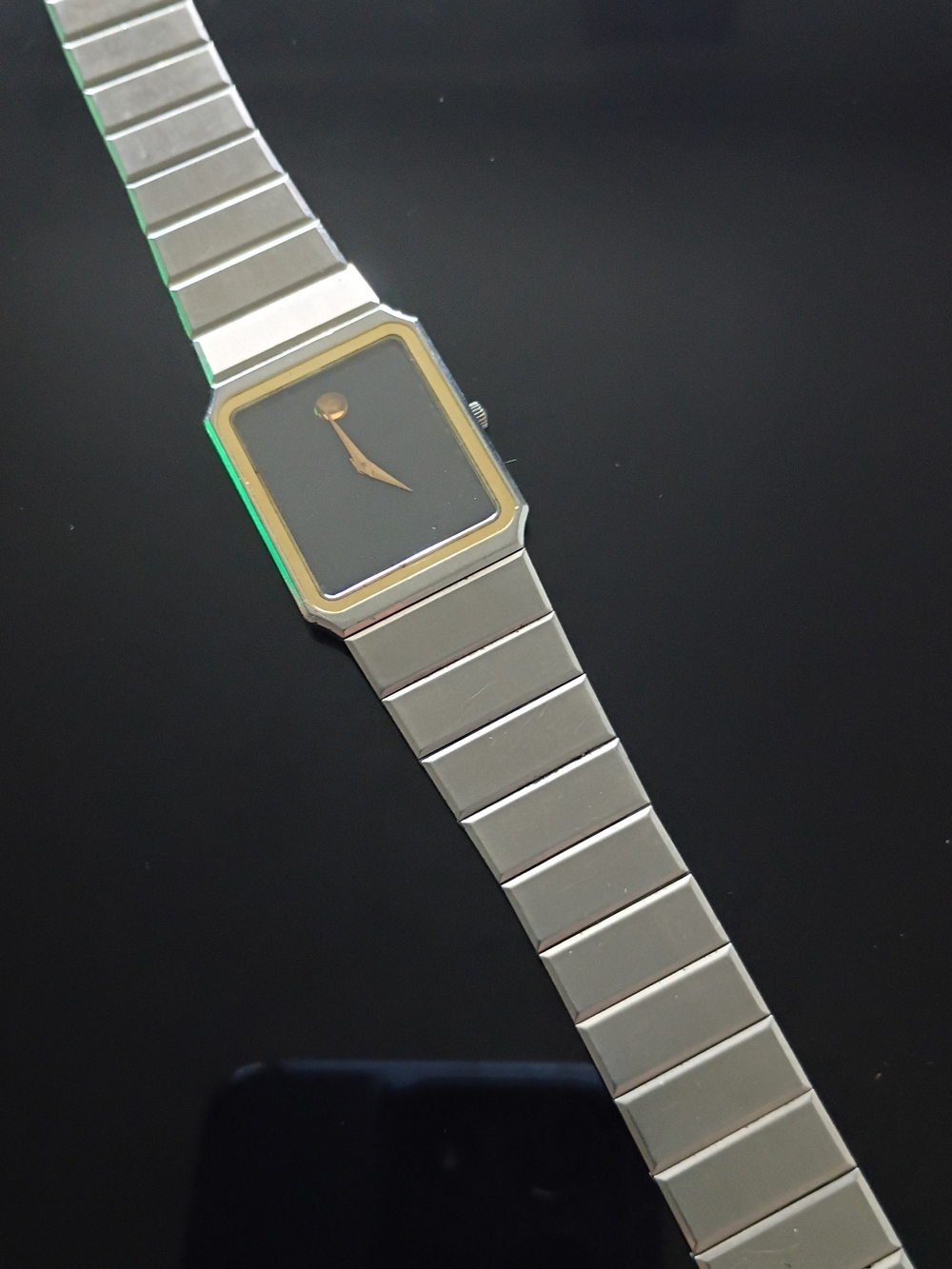 Movado Silver Watch with Black Dial and Gold Trim